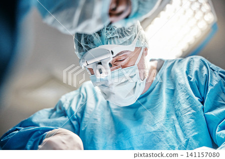 Surgery, face or surgeons with teamwork for emergency, accident or healthcare help in hospital clinic. Theatre procedure, medical icu or doctors in surgical collaboration in operating room to support Surgery, face or surgeons with teamwork for emergency, accident or healthcare help in hospital clinic. Theatre procedure, medical icu or doctors in surgical collaboration in operating room to support 141157080