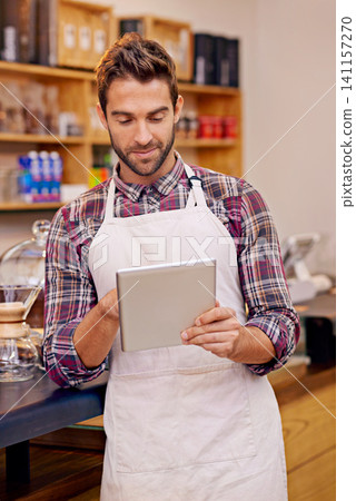 Man, barista and tablet for reading in coffee shop with smile, thinking or communication for online order. Person, waiter and digital touchscreen for typing, click or check for ecommerce in cafeteria 141157270