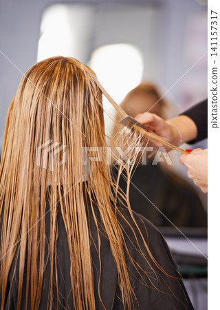 Style, cut and woman with hairdresser, comb and professional haircare, cleaning or luxury treatment. Grooming, hair care and client at beauty salon with mirror, reflection and small business service Style, cut and woman with hairdresser, comb and professional haircare, cleaning or luxury treatment. Grooming, hair care and client at beauty salon with mirror, reflection and small business service 141157317