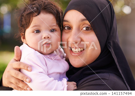 Muslim woman, mother and baby in portrait for love, care and bonding during Eid in Cape Town, South Africa. Female person, child and family together outdoor in nature, garden and backyard with smile Muslim woman, mother and baby in portrait for love, care and bonding during Eid in Cape Town, South Africa. Female person, child and family together outdoor in nature, garden and backyard with smile 141157494