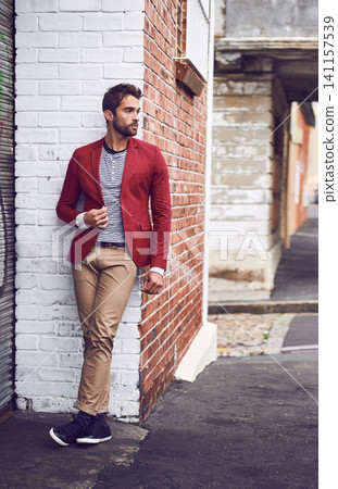 Style, thinking and man in city for travel on vacation, adventure or holiday with confidence. Pride, stylish and person with trendy, cool and casual fashion with ideas in urban town for weekend trip. Style, thinking and man in city for travel on vacation, adventure or holiday with confidence. Pride, stylish and person with trendy, cool and casual fashion with ideas in urban town for weekend trip. 141157539