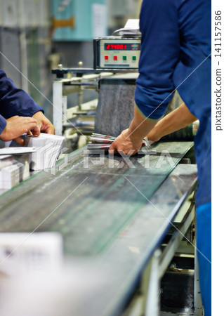 People, hands and distribution with production at factory for packaging, supply chain or manufacturing. Closeup of employees in shipping industry, export or import business of stock, cargo or product People, hands and distribution with production at factory for packaging, supply chain or manufacturing. Closeup of employees in shipping industry, export or import business of stock, cargo or product 141157586