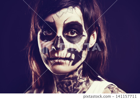 Skull, makeup and portrait of woman on black background for festival, Halloween and day of the dead. Creative art, skeleton and person with face paint for horror, scary and gothic aesthetic in studio Skull, makeup and portrait of woman on black background for festival, Halloween and day of the dead. Creative art, skeleton and person with face paint for horror, scary and gothic aesthetic in studio 141157711