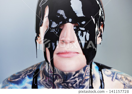 Abstract, paint and face with black ink for rock, tattoo and punk art in creative career isolated on gray background. Person, liquid and closeup for surreal, unique and grunge on studio backdrop Abstract, paint and face with black ink for rock, tattoo and punk art in creative career isolated on gray background. Person, liquid and closeup for surreal, unique and grunge on studio backdrop 141157728