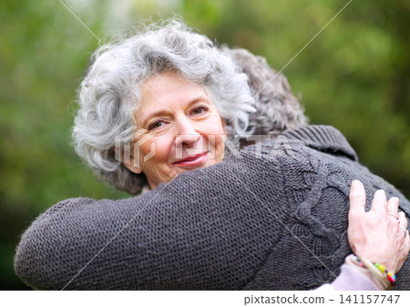 Portrait, older woman or man to hug, love or trust in nature, wellness or bonding together. Senior couple, smile or break as romantic outdoor date in marriage, partnership or commitment in retirement 141157747