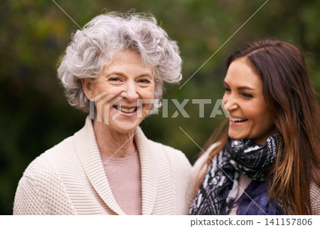 Senior woman, mother and face with daughter for love, bonding and visit from child outdoor in backyard, garden and patio. Elderly female person, young lady and family bonding together in Italy Senior woman, mother and face with daughter for love, bonding and visit from child outdoor in backyard, garden and patio. Elderly female person, young lady and family bonding together in Italy 141157806
