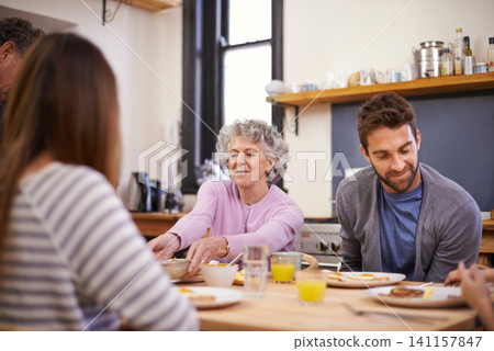 Breakfast, family home and grandparents with kitchen table, nutrition and smile with love and weekend break. Apartment, food and senior people eating meal together with conversation, joy and wellness 141157847