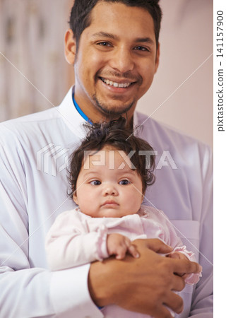Portrait, home and father with baby, smile and tradition with happiness, cheerful and bonding together. Face, Islamic family or dad with infant or embrace with joy or love with hug or eid celebration Portrait, home and father with baby, smile and tradition with happiness, cheerful and bonding together. Face, Islamic family or dad with infant or embrace with joy or love with hug or eid celebration 141157900