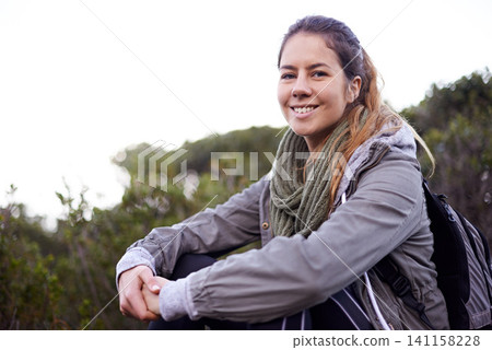 Portrait, outdoor and hiking with woman, smile and relaxing with stress relief and weekend break with nature. Face, person and hiker with flowers and healthy with wellness and countryside with hobby 141158228
