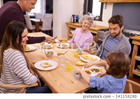 Love, breakfast and big family in a kitchen with pancakes, eating or bonding at a table together. Food, diet and kid with people in a house with waffle for brunch, nutrition or communication at home Love, breakfast and big family in a kitchen with pancakes, eating or bonding at a table together. Food, diet and kid with people in a house with waffle for brunch, nutrition or communication at home 141158280