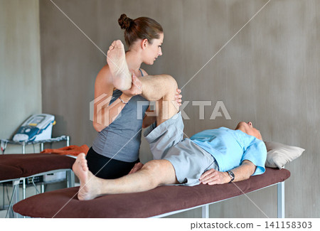 Physical therapist, legs and senior man with physiotherapy exercise at rehabilitation center. Medical, help and healthcare worker with elderly patient with consultation for muscle injury at clinic. Physical therapist, legs and senior man with physiotherapy exercise at rehabilitation center. Medical, help and healthcare worker with elderly patient with consultation for muscle injury at clinic. 141158303