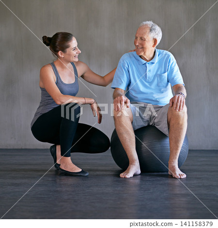 Exercise ball, consultation and physiotherapist with man for muscle exercise consultation at clinic. Physical therapy, happy and healthcare worker helping senior patient at rehabilitation center. Exercise ball, consultation and physiotherapist with man for muscle exercise consultation at clinic. Physical therapy, happy and healthcare worker helping senior patient at rehabilitation center. 141158379