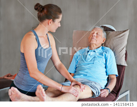 Therapist, legs and senior man with physical therapy exercise at rehabilitation center. Medical, help and physiotherapist with elderly male patient with consultation for muscle injury at clinic. Therapist, legs and senior man with physical therapy exercise at rehabilitation center. Medical, help and physiotherapist with elderly male patient with consultation for muscle injury at clinic. 141158415