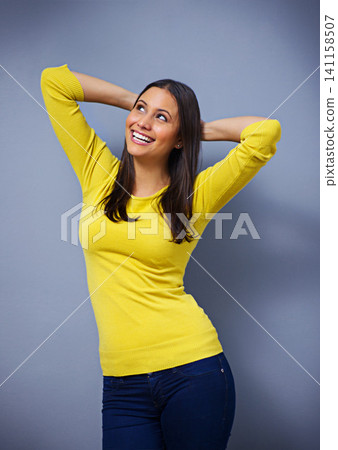 Woman, laughing and fashion in studio, happy and arms raised for ideas, excited or memory by blue background. Girl, person and model with trendy style, edgy clothes or smile with confidence in Mexico Woman, laughing and fashion in studio, happy and arms raised for ideas, excited or memory by blue background. Girl, person and model with trendy style, edgy clothes or smile with confidence in Mexico 141158507