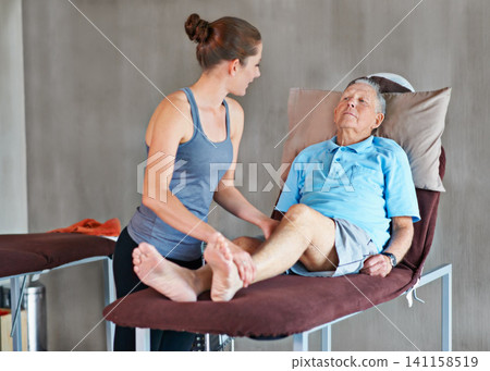 Therapist, legs and senior patient with physical therapy exercise at rehabilitation center. Medical, help and physiotherapist with elderly man with consultation for muscle injury at healthcare clinic 141158519