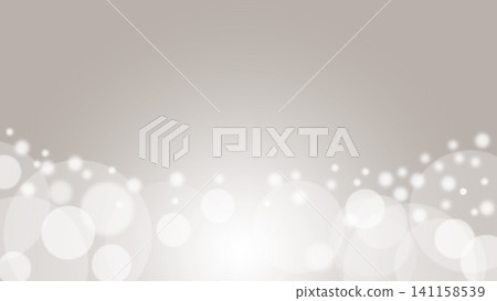 灰色背景下,中心部分明亮閃耀,底部則呈現散景效果。 灰色背景下,中心部分明亮閃耀,底部則呈現散景效果。 141158539
