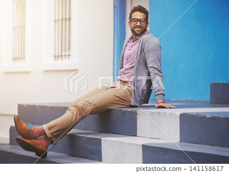 Man, fashion and happiness in city with glasses, relax with black frame for style and chic outfit. Urban, unique and trendy designer clothes, spectacles for accessory and apparel with model outdoor Man, fashion and happiness in city with glasses, relax with black frame for style and chic outfit. Urban, unique and trendy designer clothes, spectacles for accessory and apparel with model outdoor 141158617
