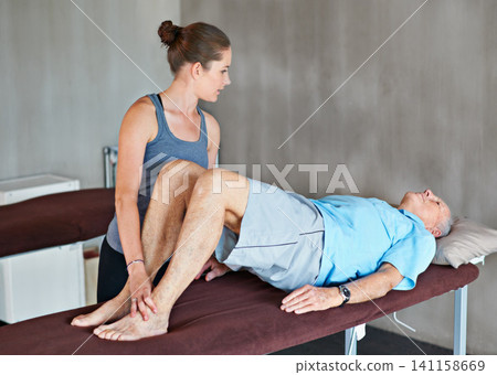 Physical therapist, consultation and elderly man with physiotherapy exercise at rehabilitation center. Medical, help and healthcare worker with senior patient with leg muscle injury at clinic. Physical therapist, consultation and elderly man with physiotherapy exercise at rehabilitation center. Medical, help and healthcare worker with senior patient with leg muscle injury at clinic. 141158669