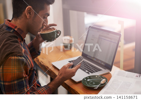 Laptop, phone and man in coffee shop in morning typing for online message, email and social media. Cafe, restaurant and person on cellphone for communication, networking and website for remote work Laptop, phone and man in coffee shop in morning typing for online message, email and social media. Cafe, restaurant and person on cellphone for communication, networking and website for remote work 141158671