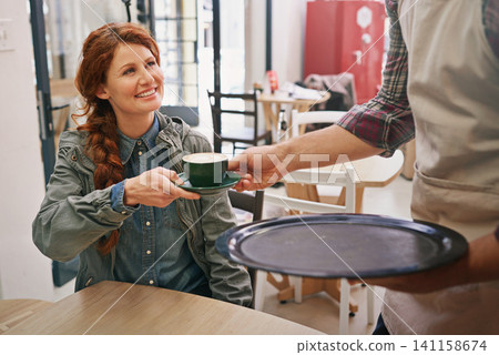 Woman, cafe and waiter giving drink for service with smile, thanks and catering in morning with kindness. People, girl and barista with tea cup, latte and happy for breakfast in coffee shop in Italy Woman, cafe and waiter giving drink for service with smile, thanks and catering in morning with kindness. People, girl and barista with tea cup, latte and happy for breakfast in coffee shop in Italy 141158674