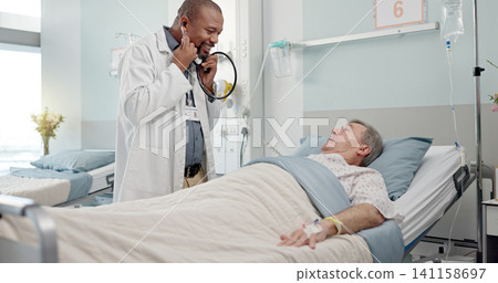Consultation, stethoscope and doctor with patient in hospital after surgery, treatment or procedure. Discussion, checkup and African male medical worker talk to senior man in clinic bed for diagnosis Consultation, stethoscope and doctor with patient in hospital after surgery, treatment or procedure. Discussion, checkup and African male medical worker talk to senior man in clinic bed for diagnosis 141158697