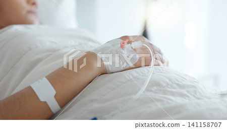 Woman hand, bed and iv drip in closeup, hospital or treatment for hydration, liquid or supplement. Person, healthcare and wellness for blood transfusion, anesthesia or pharma drugs for pain in clinic Woman hand, bed and iv drip in closeup, hospital or treatment for hydration, liquid or supplement. Person, healthcare and wellness for blood transfusion, anesthesia or pharma drugs for pain in clinic 141158707