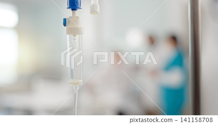 IV drip, liquid and medicine in a hospital for healthcare, virus or help in an emergency. Health, clinic and a fluid, solution or drug for medical treatment, therapy or infusion for a disease IV drip, liquid and medicine in a hospital for healthcare, virus or help in an emergency. Health, clinic and a fluid, solution or drug for medical treatment, therapy or infusion for a disease 141158708