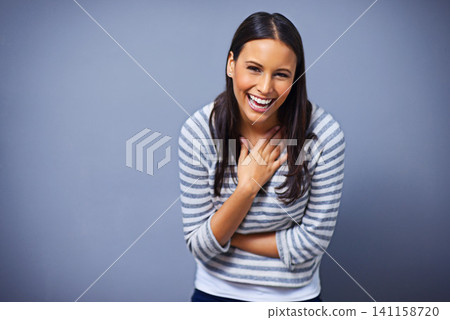 Woman, positive and laugh in studio portrait for funny joke, humor and comedy on blue background. Female person, mockup space and smile for comic satisfaction, confidence and silly or goofy enjoyment Woman, positive and laugh in studio portrait for funny joke, humor and comedy on blue background. Female person, mockup space and smile for comic satisfaction, confidence and silly or goofy enjoyment 141158720
