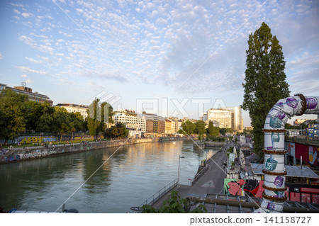 Vienna, Austria - June 13, 2023: Embankment the Danube Canal in Vienna Vienna, Austria - June 13, 2023: Embankment the Danube Canal in Vienna 141158727
