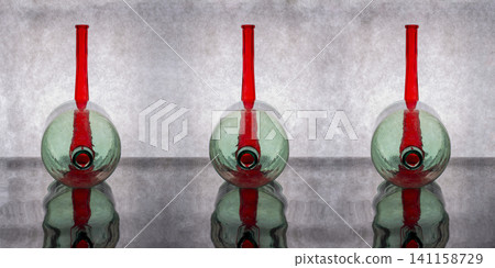 Still life with glass bottles and reflection 141158729