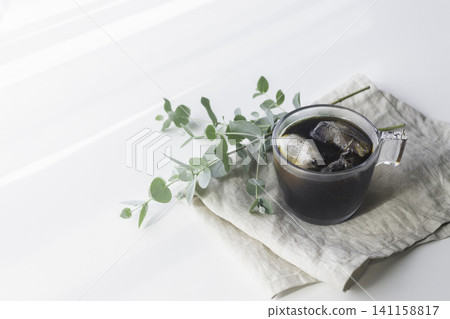 A cafe-style table with iced coffee and cookies, photographed in natural light. A cafe-style table with iced coffee and cookies, photographed in natural light. 141158817