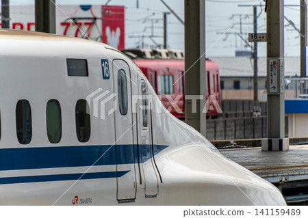 The Tokaido Shinkansen and Meitetsu Hashima Line passing through Gifu-Hashima Station The Tokaido Shinkansen and Meitetsu Hashima Line passing through Gifu-Hashima Station 141159489