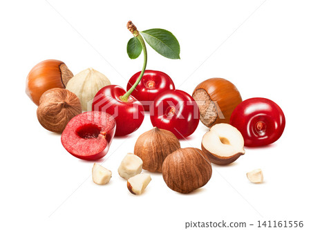 Sweet cherries, hazelnut whole nuts and pieces isolated on white background. Real photography Sweet cherries, hazelnut whole nuts and pieces isolated on white background. Real photography 141161556