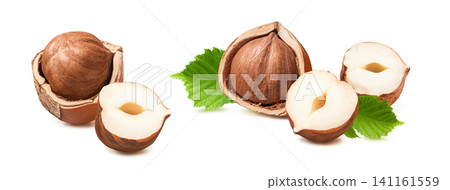 Whole and cracked hazelnut nuts with leaves set isolated on white background. Real photography. Whole and cracked hazelnut nuts with leaves set isolated on white background. Real photography. 141161559
