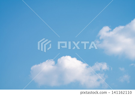 Beautiful blue sky and white cumulus clouds abstract background. Cloudscape background. Blue sky and fluffy white clouds on sunny days. Beautiful blue sky. World Ozone Day. Ozone layer. Summer sky. Beautiful blue sky and white cumulus clouds abstract background. Cloudscape background. Blue sky and fluffy white clouds on sunny days. Beautiful blue sky. World Ozone Day. Ozone layer. Summer sky. 141162110