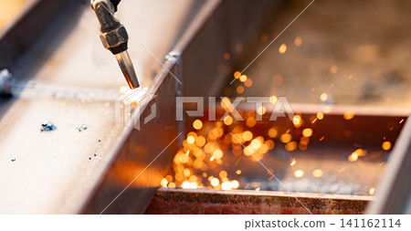 Skilled labor and craftsmanship in metal fabrication. Use of torches for cutting metal. Safety measures and personal protective equipment for metalworkers. Precision and accuracy in metal cutting. Skilled labor and craftsmanship in metal fabrication. Use of torches for cutting metal. Safety measures and personal protective equipment for metalworkers. Precision and accuracy in metal cutting. 141162114