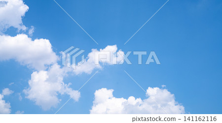 Beautiful blue sky and white cumulus clouds abstract background. Cloudscape background. Blue sky and fluffy white clouds on sunny days. Beautiful blue sky. World Ozone Day. Ozone layer. Summer sky. Beautiful blue sky and white cumulus clouds abstract background. Cloudscape background. Blue sky and fluffy white clouds on sunny days. Beautiful blue sky. World Ozone Day. Ozone layer. Summer sky. 141162116