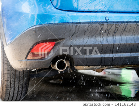 Car washing with spray water. Car cleaning. Auto care service concept. Vehicle cleaning. Cleaning with spray water for vehicle care and maintenance. Vehicle hygiene. Car washing and care. Car washing with spray water. Car cleaning. Auto care service concept. Vehicle cleaning. Cleaning with spray water for vehicle care and maintenance. Vehicle hygiene. Car washing and care. 141162148