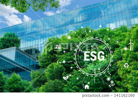 ESG concept. Eco-friendly building in modern city. Sustainable glass office building with tree for reducing carbon dioxide. Office building with green environment. Corporate building use clean energy. ESG concept. Eco-friendly building in modern city. Sustainable glass office building with tree for reducing carbon dioxide. Office building with green environment. Corporate building use clean energy. 141162160