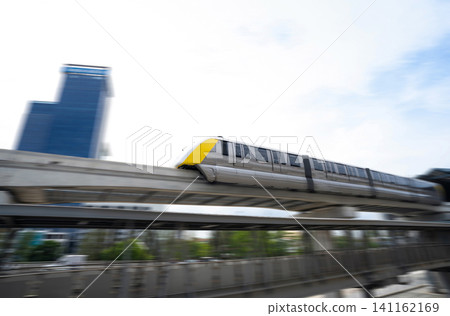 Elevated monorail train fast move on rail. Public transit monorail. Modern mass transit. Rail transportation. Driverless straddle monorail. Monorail technology. Rapid transit in city. Urban transport. Elevated monorail train fast move on rail. Public transit monorail. Modern mass transit. Rail transportation. Driverless straddle monorail. Monorail technology. Rapid transit in city. Urban transport. 141162169