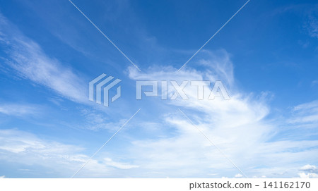 Blue sky and white cirrocumulus clouds texture background. Blue sky on sunny day. Summer sky. Cloud formation. Fluffy clouds. Nice weather in summer season. Weather pattern. Atmospheric phenomenon. Blue sky and white cirrocumulus clouds texture background. Blue sky on sunny day. Summer sky. Cloud formation. Fluffy clouds. Nice weather in summer season. Weather pattern. Atmospheric phenomenon. 141162170