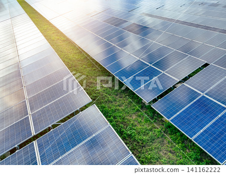 Solar farm and sun light. Solar power for green energy. Sustainable renewable energy. Photovoltaic power station or solar park. Solar panel installation and maintenance concept. Energy sustainability. Solar farm and sun light. Solar power for green energy. Sustainable renewable energy. Photovoltaic power station or solar park. Solar panel installation and maintenance concept. Energy sustainability. 141162222