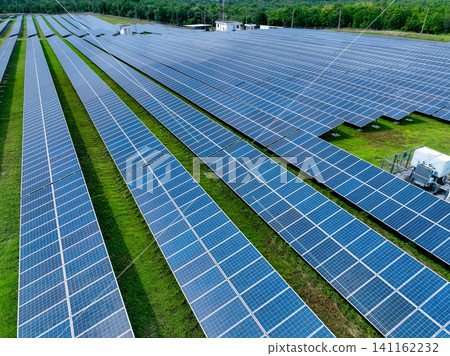 Aerial view of solar farm. Solar power for green energy. Sustainable resources. Solar cell panels use sun light as a source to generate electricity. Photovoltaics or PV. Sustainable renewable energy. Aerial view of solar farm. Solar power for green energy. Sustainable resources. Solar cell panels use sun light as a source to generate electricity. Photovoltaics or PV. Sustainable renewable energy. 141162232