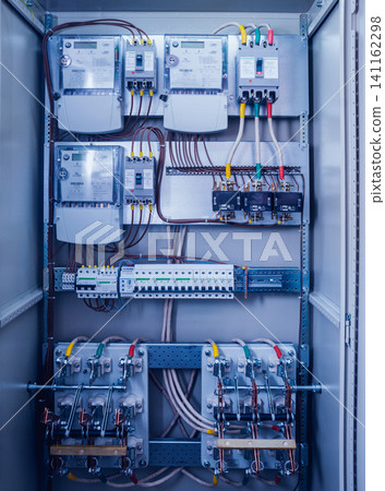 Wires and switches in electric box. Electrical panel with fuses and contactors Wires and switches in electric box. Electrical panel with fuses and contactors 141162298