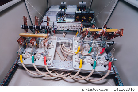 Wires and switches in electric box. Electrical panel with fuses and contactors Wires and switches in electric box. Electrical panel with fuses and contactors 141162316