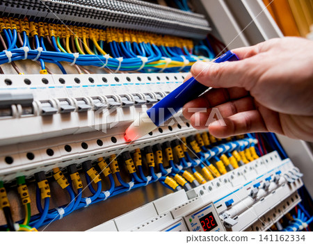 Checking voltage in switchboard with a detector Checking voltage in switchboard with a detector 141162334