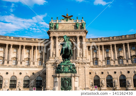 Vienna, Austria: The equestrian statue of the hero Prince Eugene and the Hofburg Palace (New Palace) stand tall against the blue sky. Vienna, Austria: The equestrian statue of the hero Prince Eugene and the Hofburg Palace (New Palace) stand tall against the blue sky. 141162430