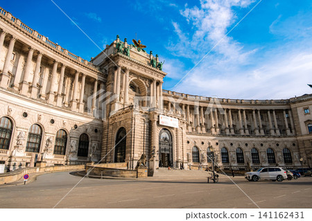 Vienna, Austria: The magnificent main entrance to the Hofburg Palace (New Palace), with its beautifully curved lines. Vienna, Austria: The magnificent main entrance to the Hofburg Palace (New Palace), with its beautifully curved lines. 141162431