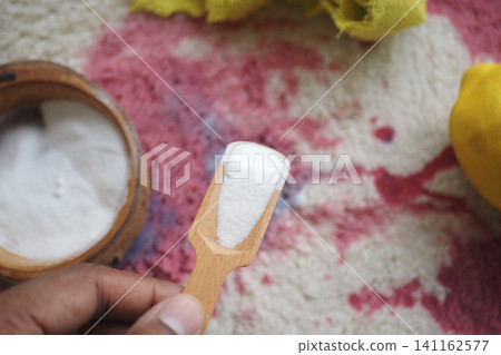 Wooden Scoop Of Baking Soda With Lemon And Bowl On Colorful Cloth For Natural Cleaning Wooden Scoop Of Baking Soda With Lemon And Bowl On Colorful Cloth For Natural Cleaning 141162577