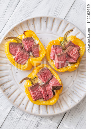 Roasted Yellow Bell Peppers Stuffed With Cream Cheese And Juicy Steak Slices Roasted Yellow Bell Peppers Stuffed With Cream Cheese And Juicy Steak Slices 141162689